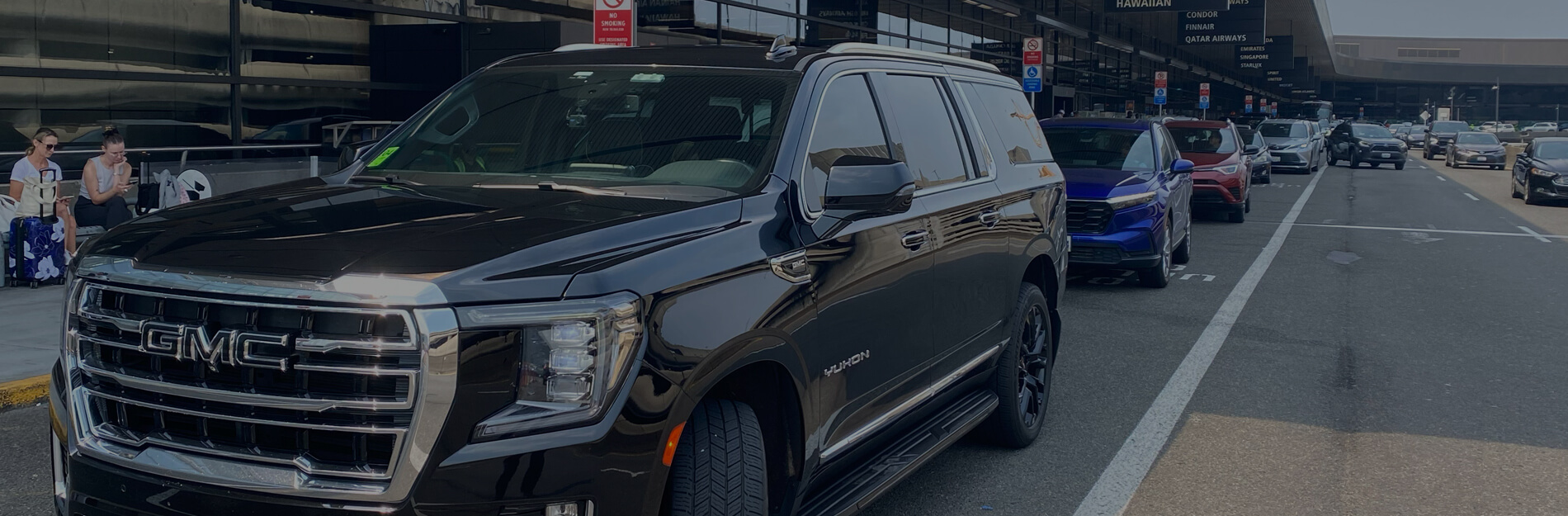 Starline's full size SUV picking up a passenger at SeaTac airport