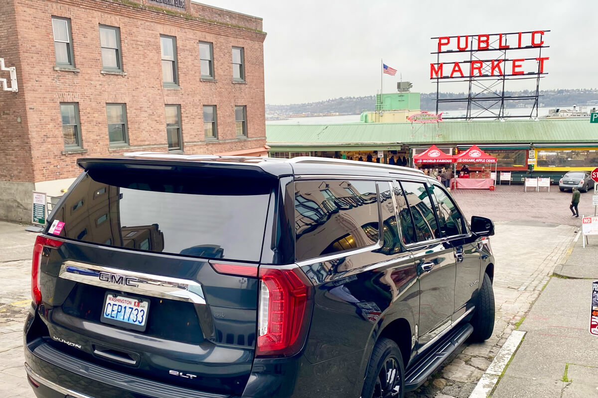 Black GMC SUV providing Seattle chauffeur service near Pike Place Market