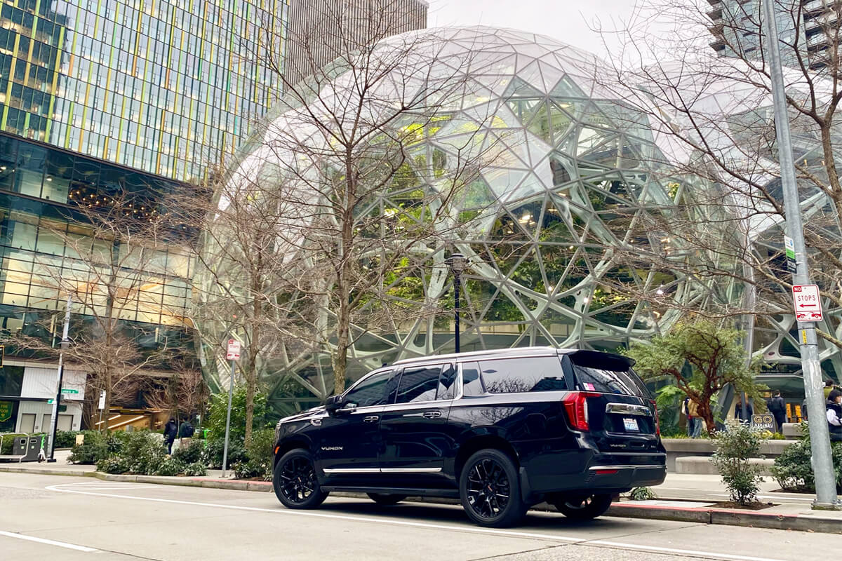 Black luxury SUV providing chauffeur service near the Amazon Spheres in Seattle