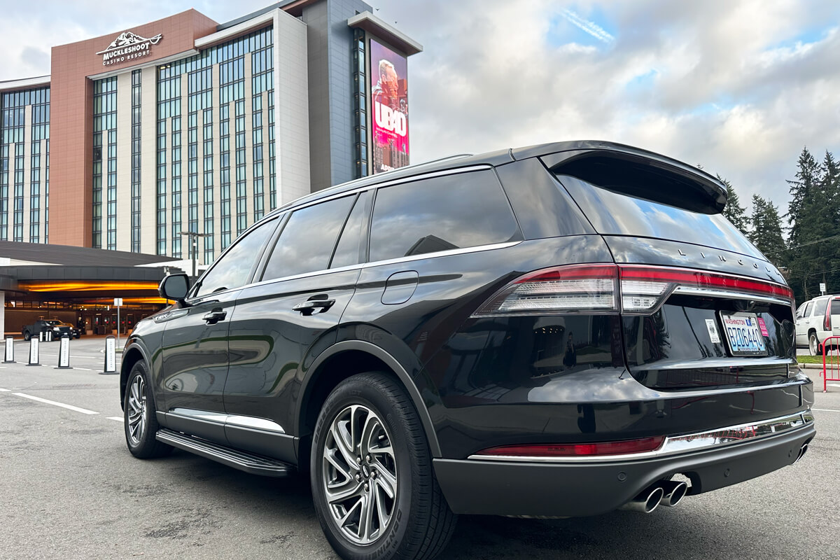 Black luxury SUV parked at Muckleshoot Casino Resort for private chauffeur service