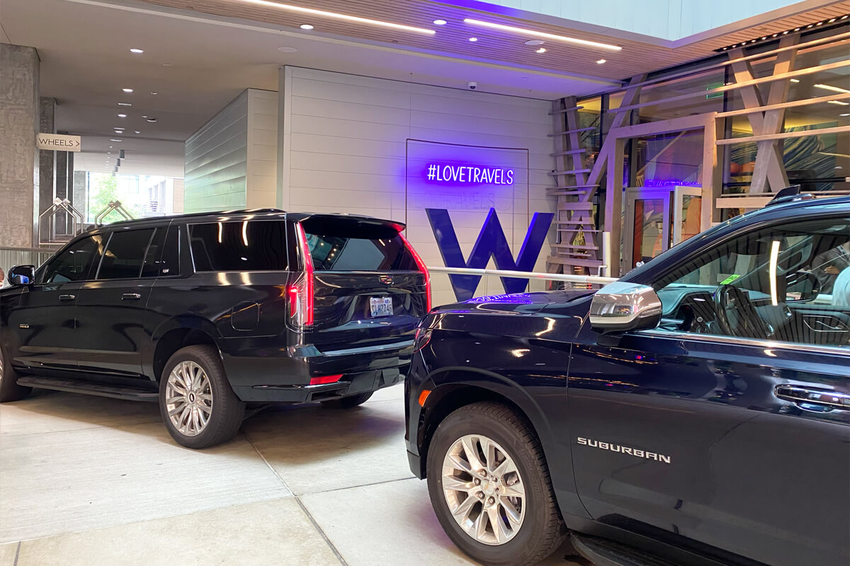 Chauffeur SUVs providing pickup service at the W Bellevue hotel for airport and evening transportation