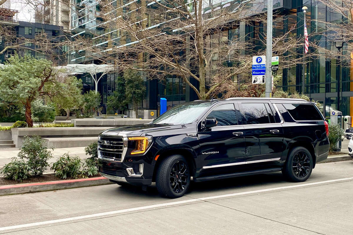 Starline's black SUV chauffeur vehicle parked on a downtown Seattle street as part of Greater Seattle service coverage.