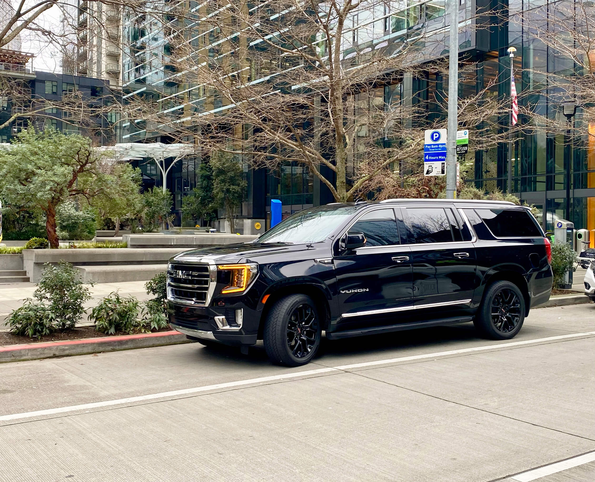 Black luxury SUV providing private chauffeur and airport transportation service for Renton, Washington clients.