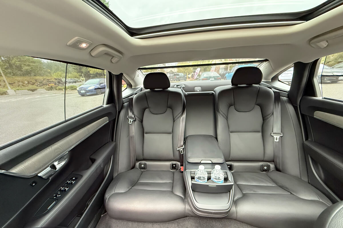Luxury sedan interior with spacious leather seating and amenities for private chauffeur service in Renton, Washington