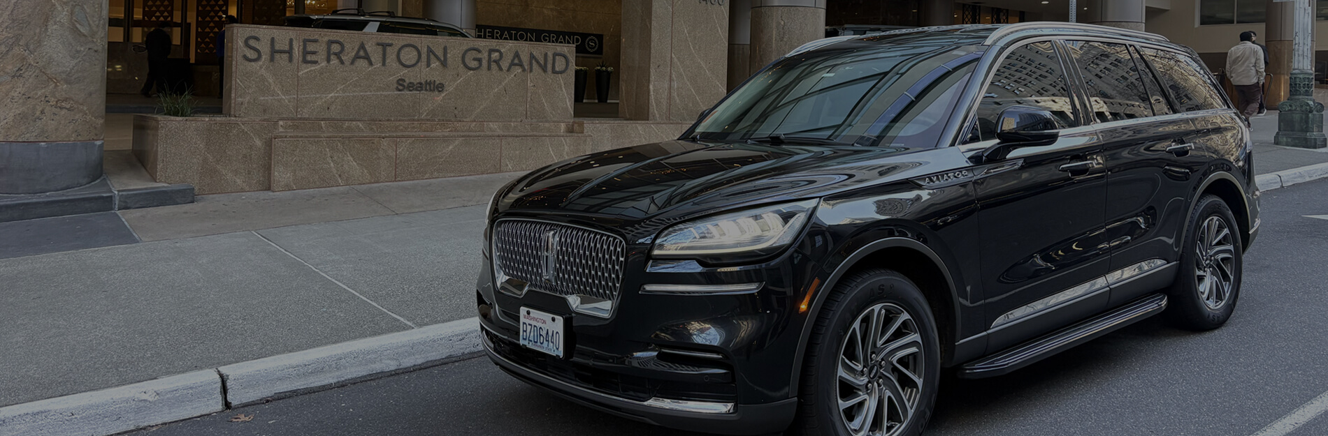 Starline's luxury SUV parked outside Sheraton Grand Seattle