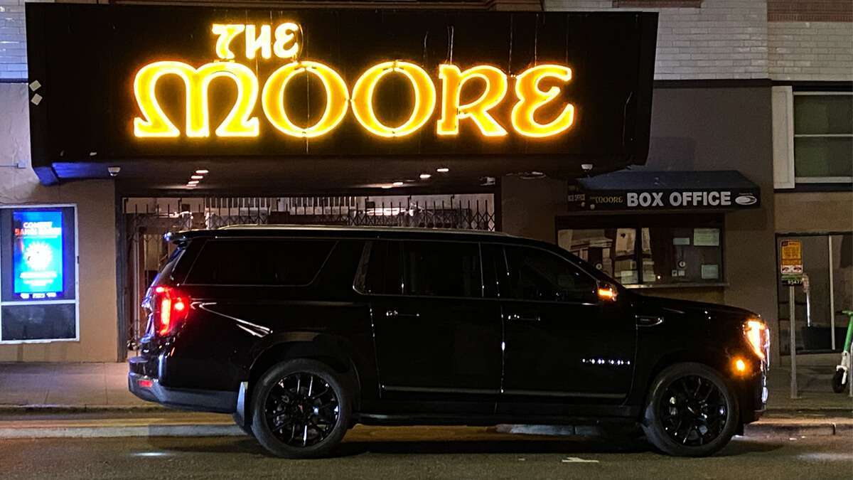 Black SUV outside Seattle’s Moore Theatre for private concert car service