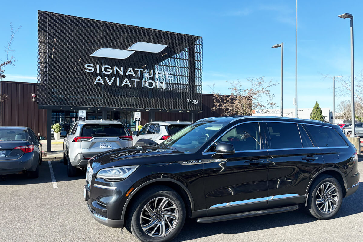 Black Lincoln Aviator parked at Signature Aviation in Seattle for private aviation pickup and drop-off