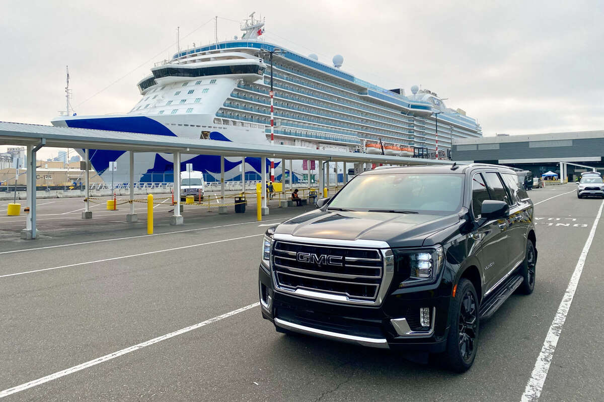 Black Starline SUV parked near a cruise ship at a Seattle cruise terminal for airport-to-pier transfer service